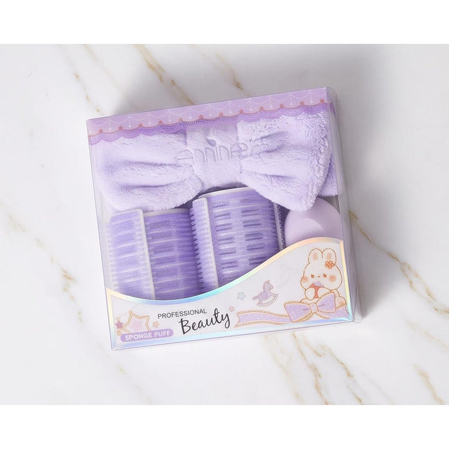 Rollers, a plush headband, and a soft powder puff-Accessories