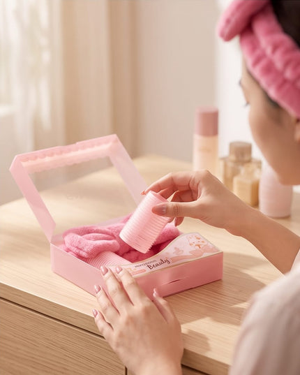 Rollers, a plush headband, and a soft powder puff-Accessories