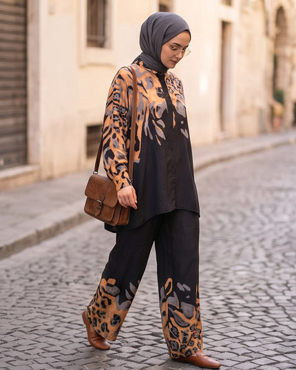 Brand Zee two-piece co-ord set with black, ochre, and grey animal print, featuring a long-sleeve shirt and wide trousers