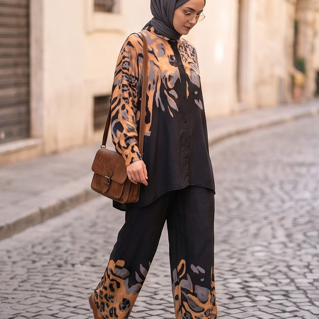 Brand Zee two-piece co-ord set with black, ochre, and grey animal print, featuring a long-sleeve shirt and wide trousers