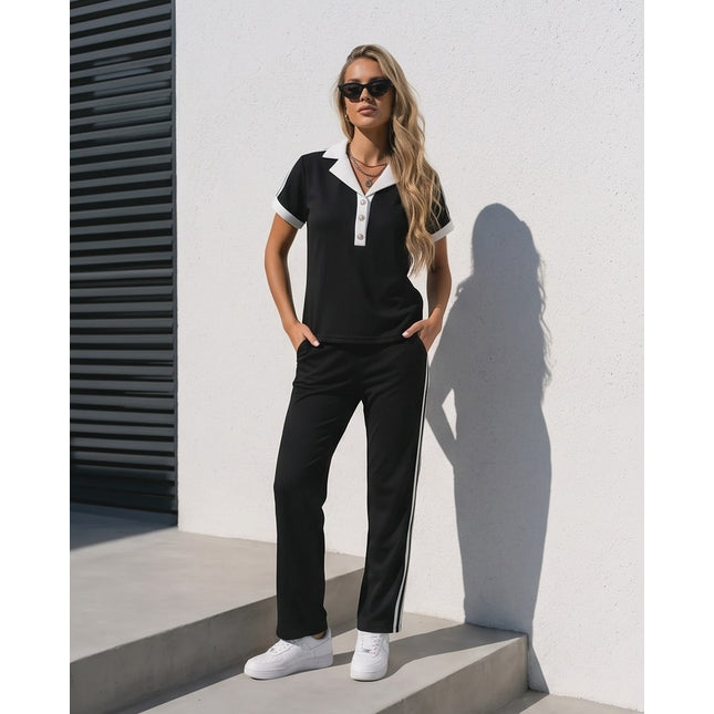 Brand Zee black ribbed lounge set with white polo collar, button detail, and side-stripe trousers on a blonde model.