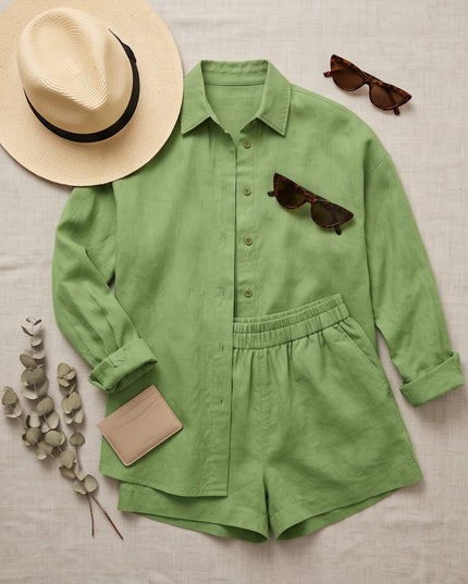 Brand Zee sage green relaxed linen-look shirt and shorts co-ord set with a straw hat and sunglasses