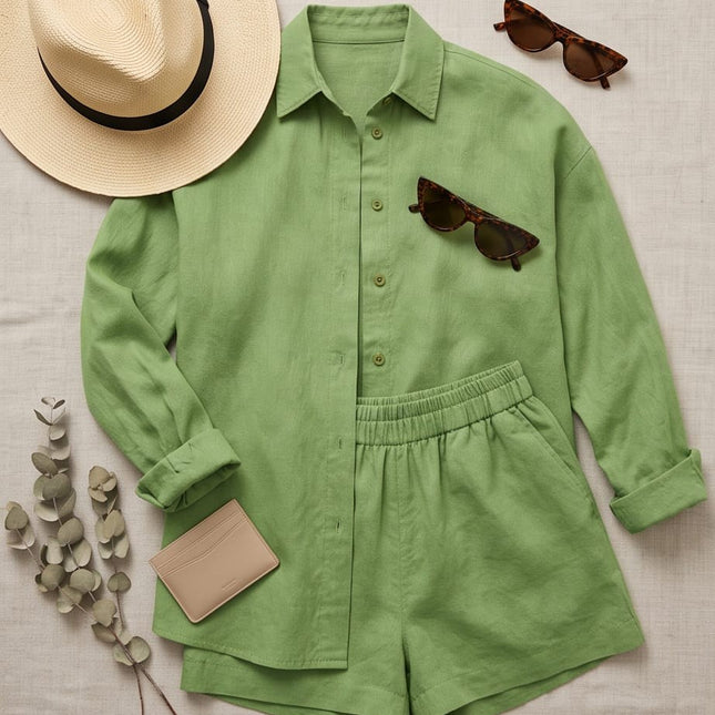 Brand Zee sage green relaxed linen-look shirt and shorts co-ord set with a straw hat and sunglasses