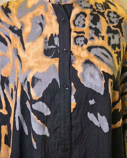 Brand Zee button-down shirt featuring an abstract animal print in ochre, charcoal, and black on lightweight fabric.