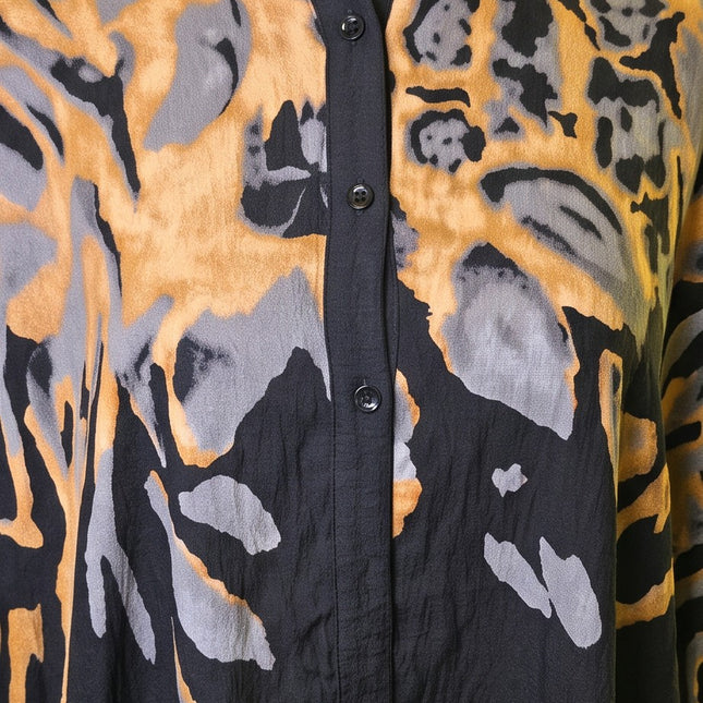 Brand Zee button-down shirt featuring an abstract animal print in ochre, charcoal, and black on lightweight fabric.