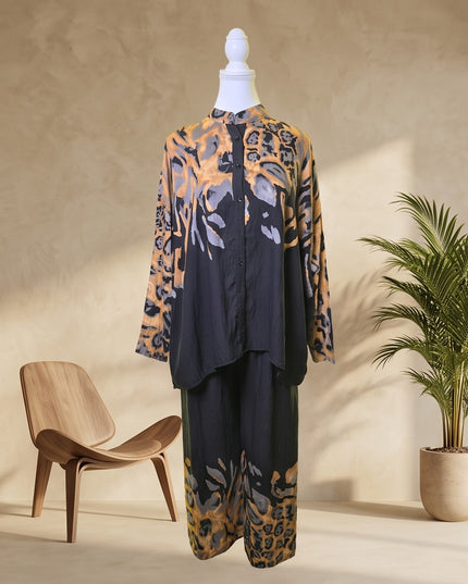 Brand Zee co-ord set featuring a long-line button-down shirt and wide-leg trousers in an ochre and charcoal animal print