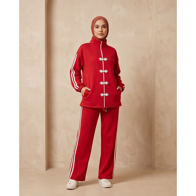 Brand Zee red two-piece sporty tracksuit with white side stripes and decorative knot fastenings on a zip-up top.