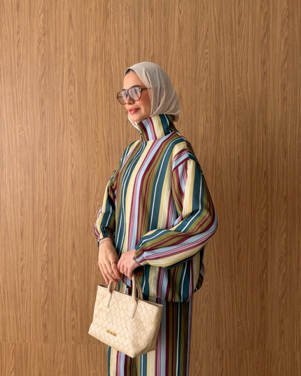 Brand Zee striped high-neck blouse and trousers set in multicolour, worn with a beige hijab and woven handbag.