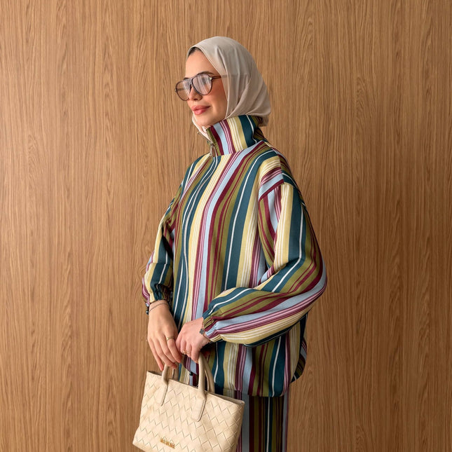 Brand Zee striped high-neck blouse and trousers set in multicolour, worn with a beige hijab and woven handbag.