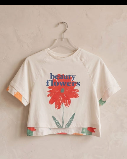 Brand Zee white cotton cropped t-shirt featuring a red flower graphic and beauty flowers text on a hanger