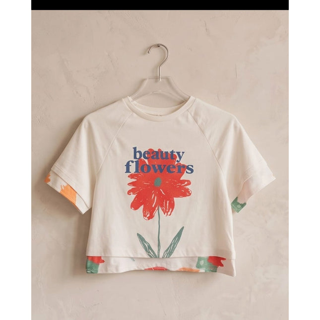 Brand Zee white cotton cropped t-shirt featuring a red flower graphic and beauty flowers text on a hanger